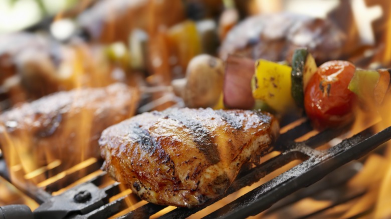 Chicken thighs cooking on a grill