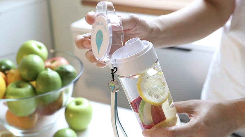 Person opening Define Bottle