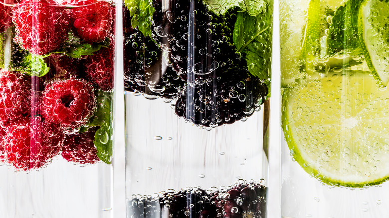 Three kinds of fruit infused water in a row