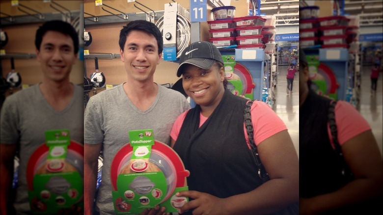Michael Tseng posing with customer