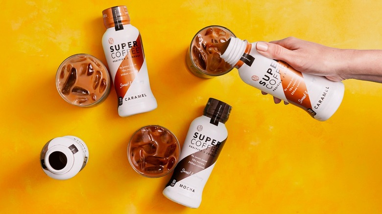 Three Super Coffee products aside three cups of coffee