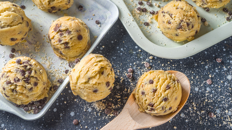 Spoon scooping dough onto trays
