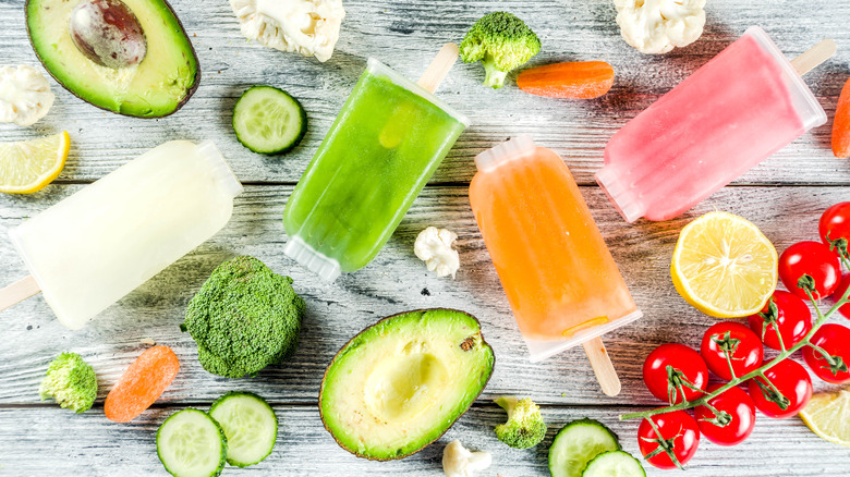 veggie popsicles scattered across table