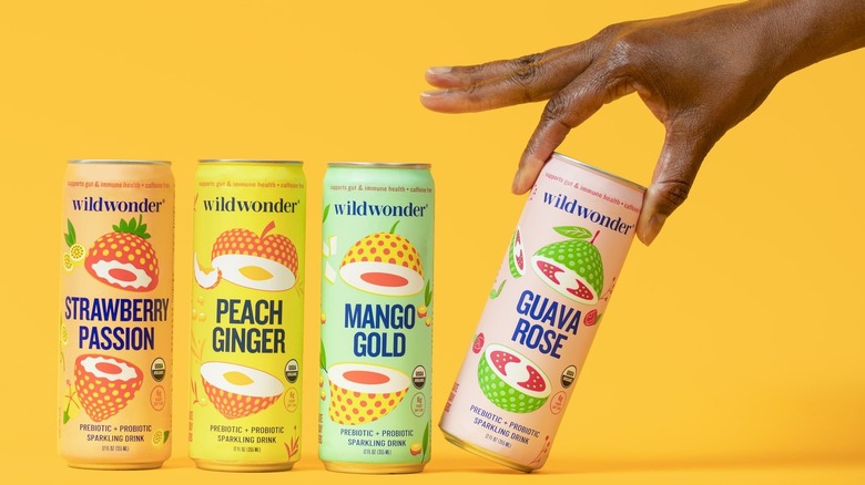 hand grabbing Wildwonder Guava Rose