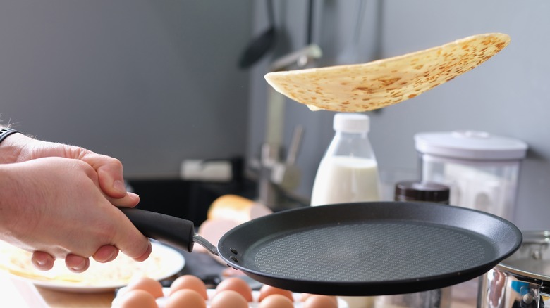chef tossing a pancake