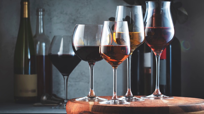 A lineup of different wines in glasses