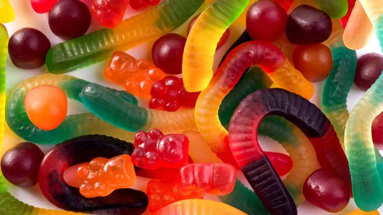 overhead shot of gummy worms and gummy bears in various colors