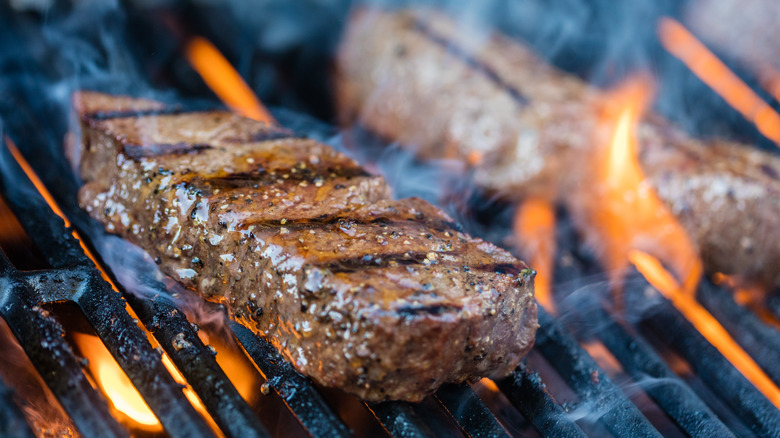 Steak being flame grilled