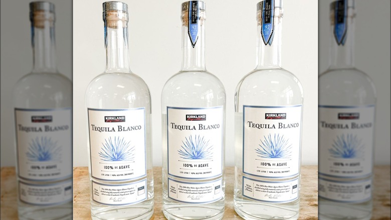 3 bottles kirkland signature tequila blanco on table