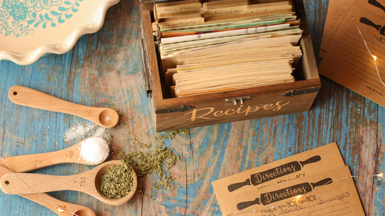 recipe rolodex next to spice measuring spoons