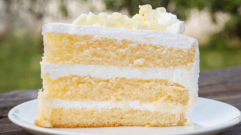 white vanilla cake slice on white plate