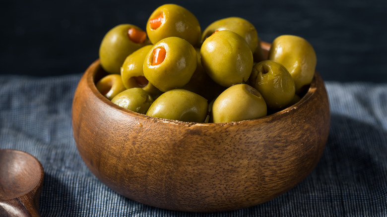 Pimento olives in wooden bowl