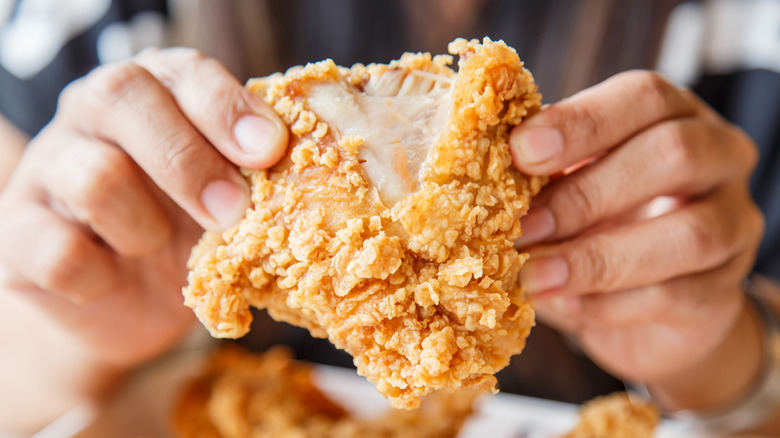 fried chicken being pulled apart