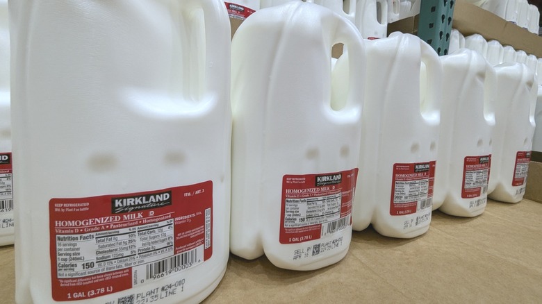 Gallons of Kirkland Signature milk on warehouse pallet