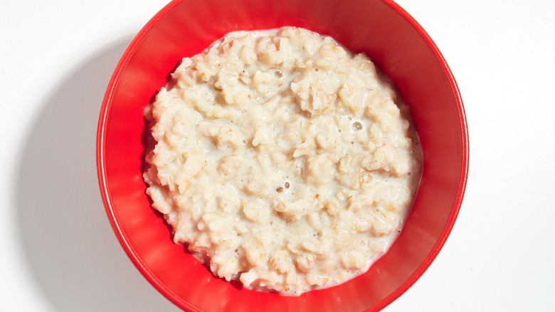 Red bowl filled with oatmeal