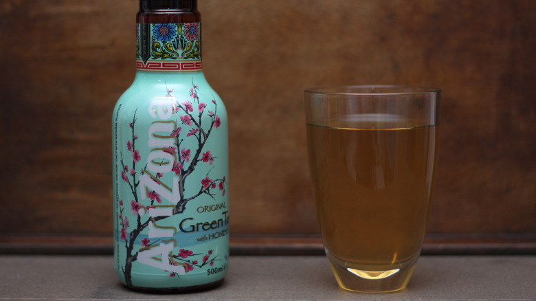 bottle of Arizona tea with glass