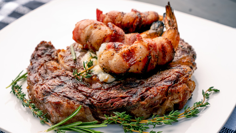 steak topped with shrimp