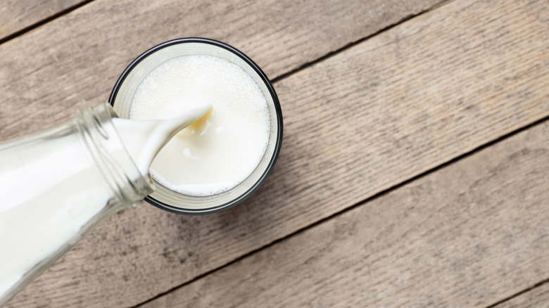 pouring a glass of milk