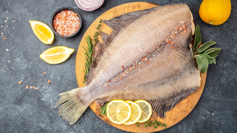 Raw flounder on cutting board