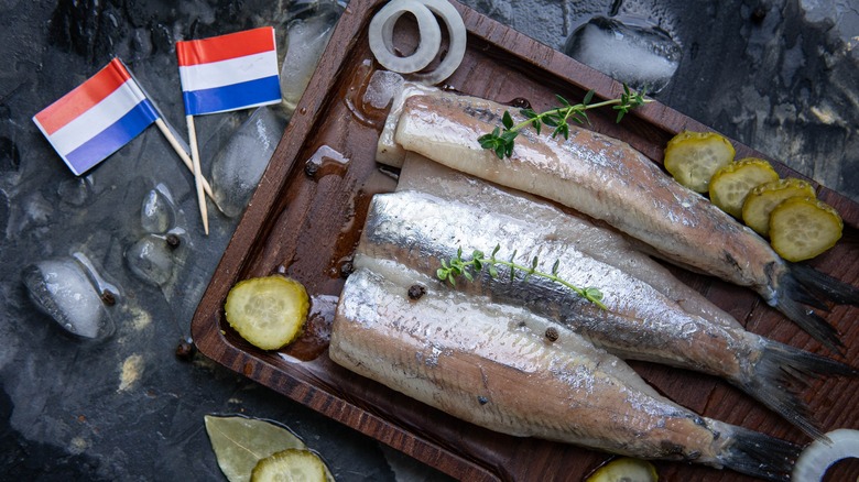 Fresh herring on a wooden board