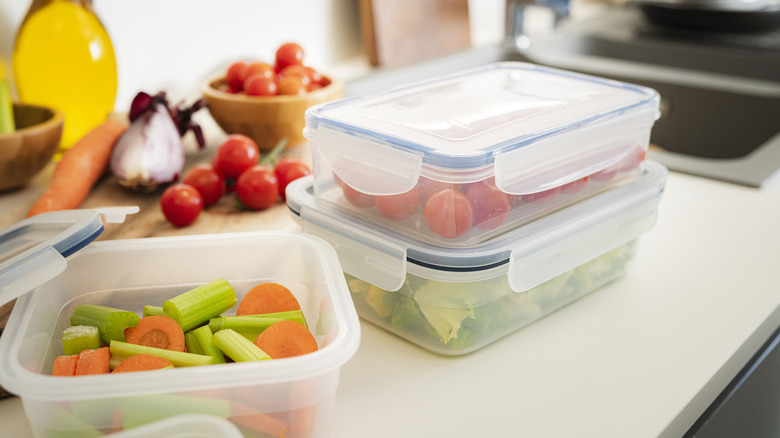 Airtight plastic food containers filled with vegetables