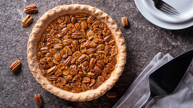 Pecan pie on black background
