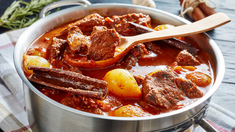 Beef stew with cinnamon sticks