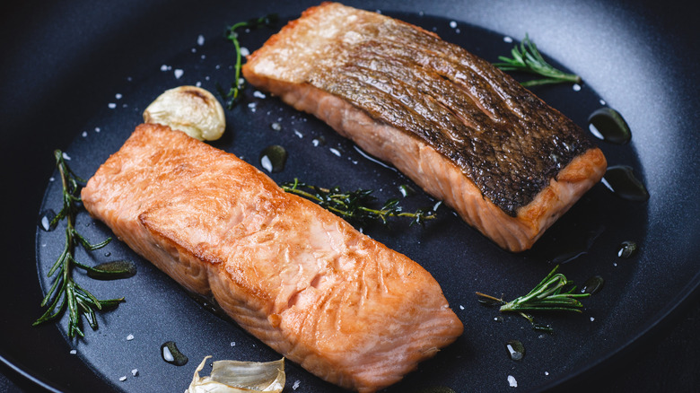 Salmon fillets in nonstick pan