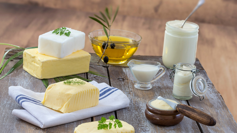 variety of cooking fats on rustic background