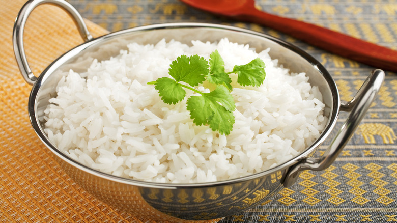 Perfectly cooked rice in a metal bowl. 