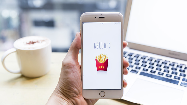 McDonald's on phone in front of desk