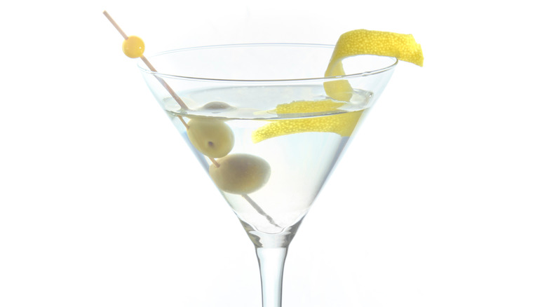 martini with olives and lemon twist