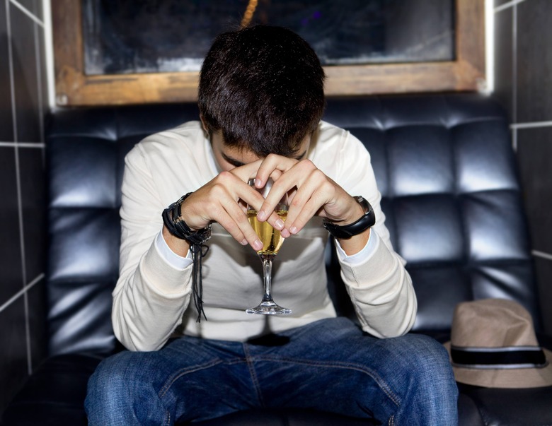 Sad guy with champagne