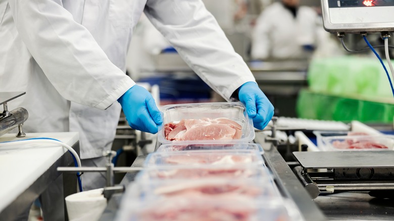 meat packing personnel with meat