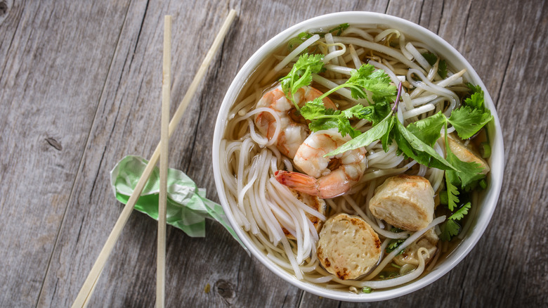 bowl of pho with chopsticks