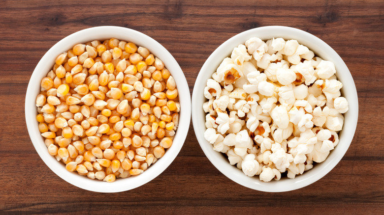 bowls of unpopped and popped popcorn