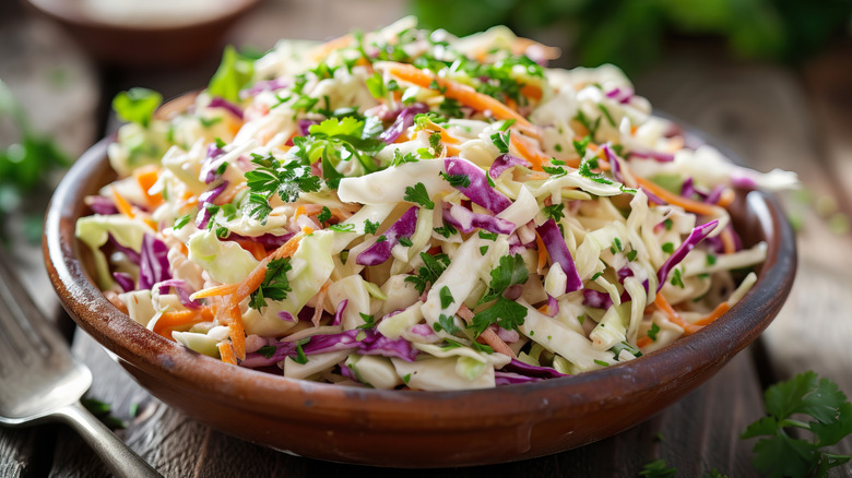 Fresh, colorful coleslaw in a wooden bowl