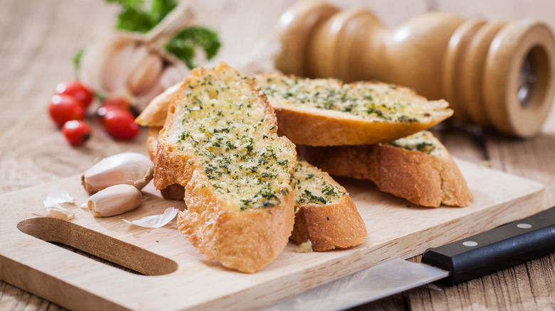 Freshly baked garlic bread and herbs
