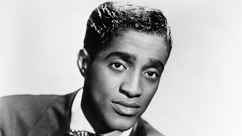 Sammy Davis Jr. posing in black and white photo