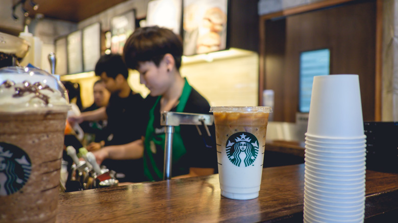 Starbucks workers and cups