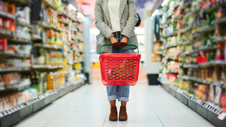 Person in grocery store aisle