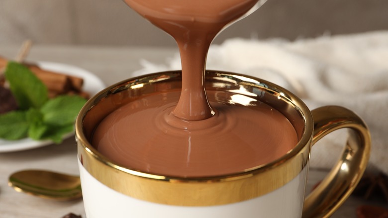 Hot chocolate poured in cup