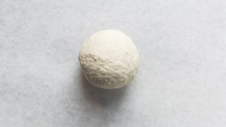 Noodle dough on a marble countertop