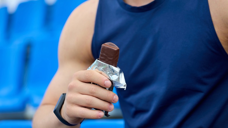 man eating ice cream bar