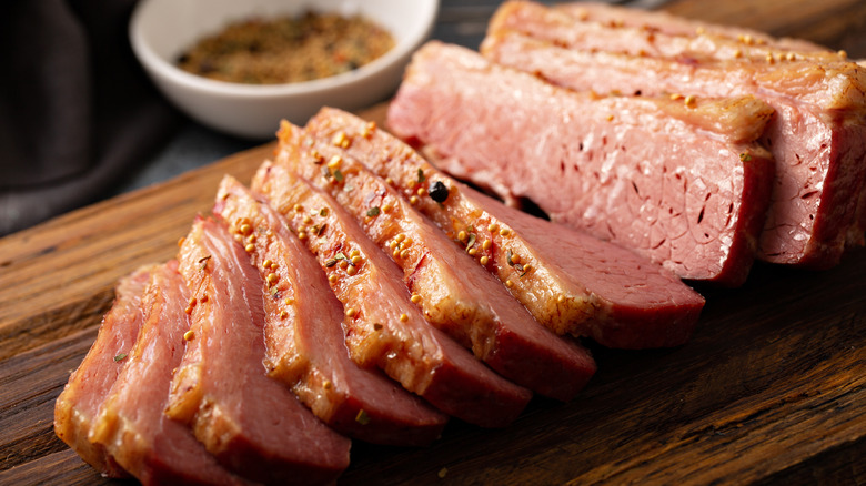 sliced corned beef on cutting board