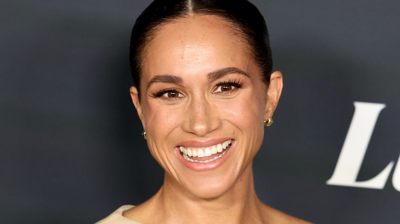 Meghan Markle smiles for photo