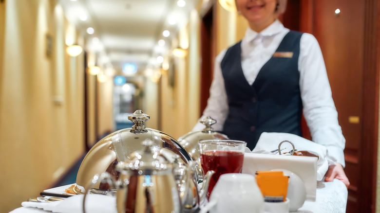 server with room service cart