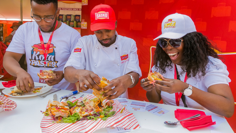 judges trying food at competition