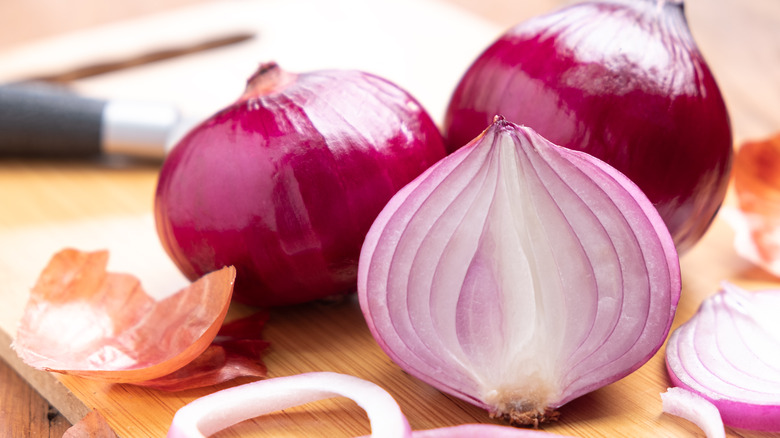 Red onions on cutting board