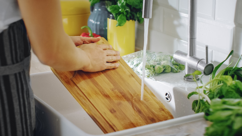 Washing cutting board in the sink